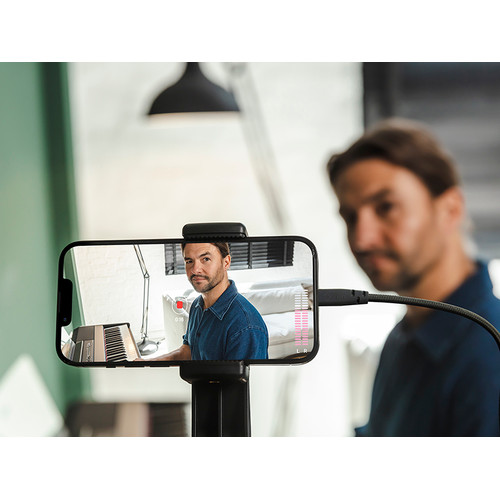 A view of the Yamaha Rec'n'Share app icon and a person taking a smartphone video of them playing