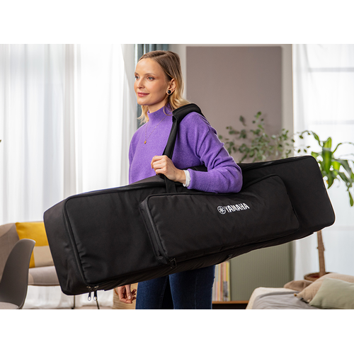 A person carrying the P-145BT dedicated keyboard bag on their shoulder