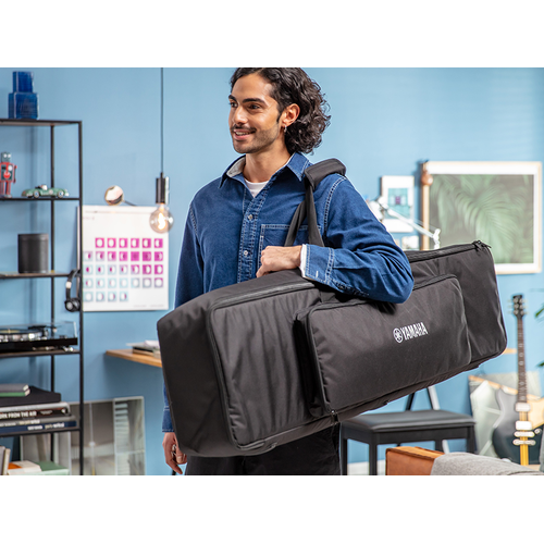 A person carrying the P-225 dedicated keyboard bag on their shoulder